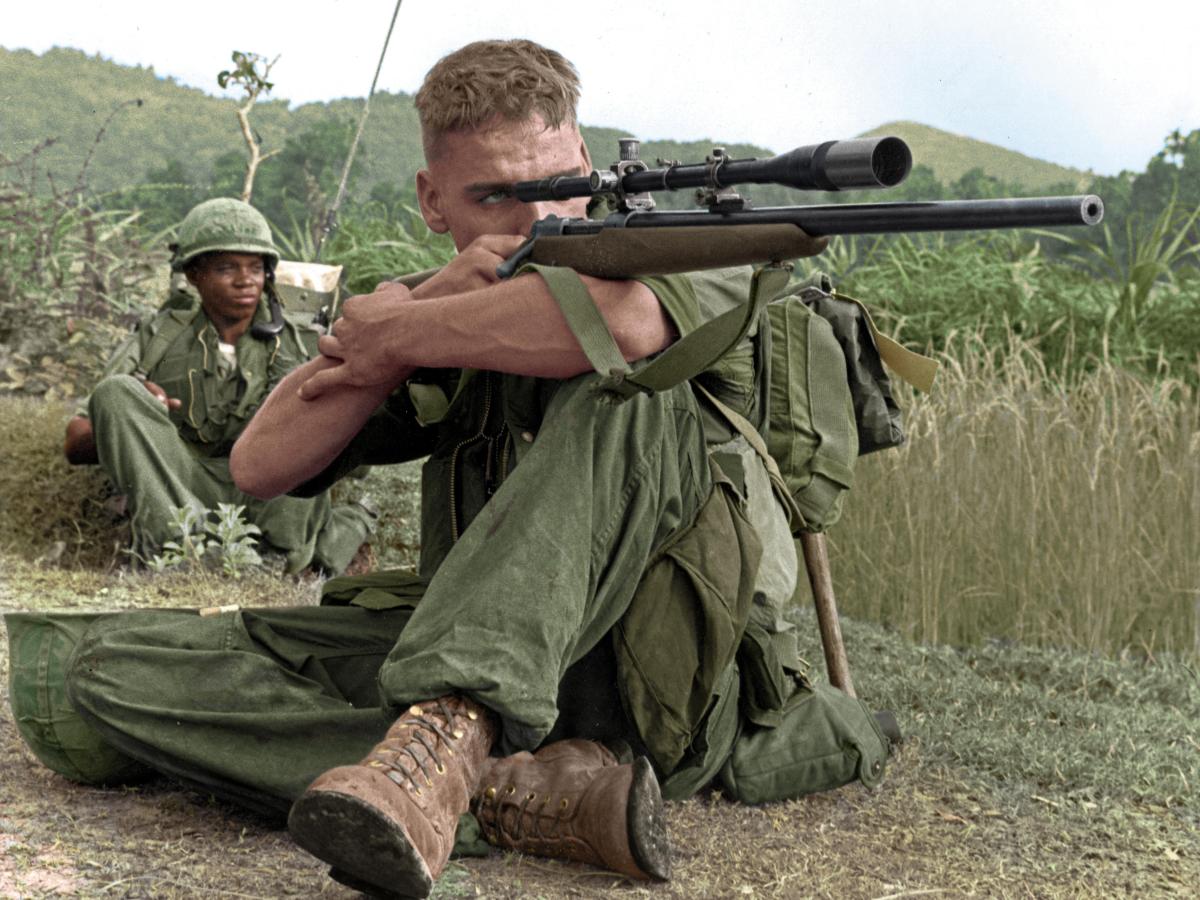 Marine Lance Corporal Dalton Gunderson checking the area for Viet Cong snipers during Operation Virginia in&nbsp;1966